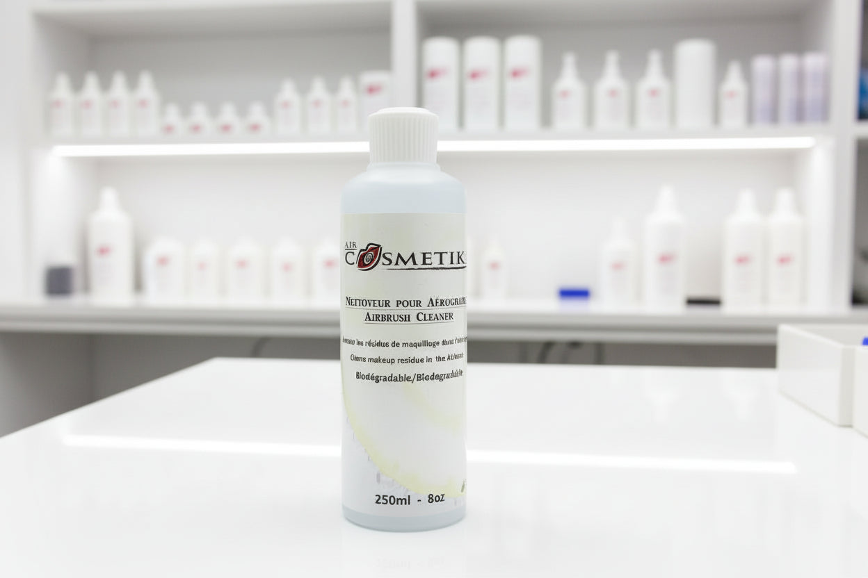 Bottle of Airbrush Cleaner with 'Cosmetik' branding on a white background